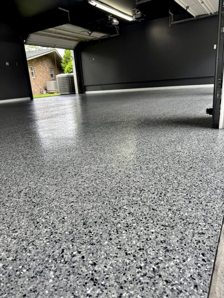 Gray flake garage floor coating with the door open