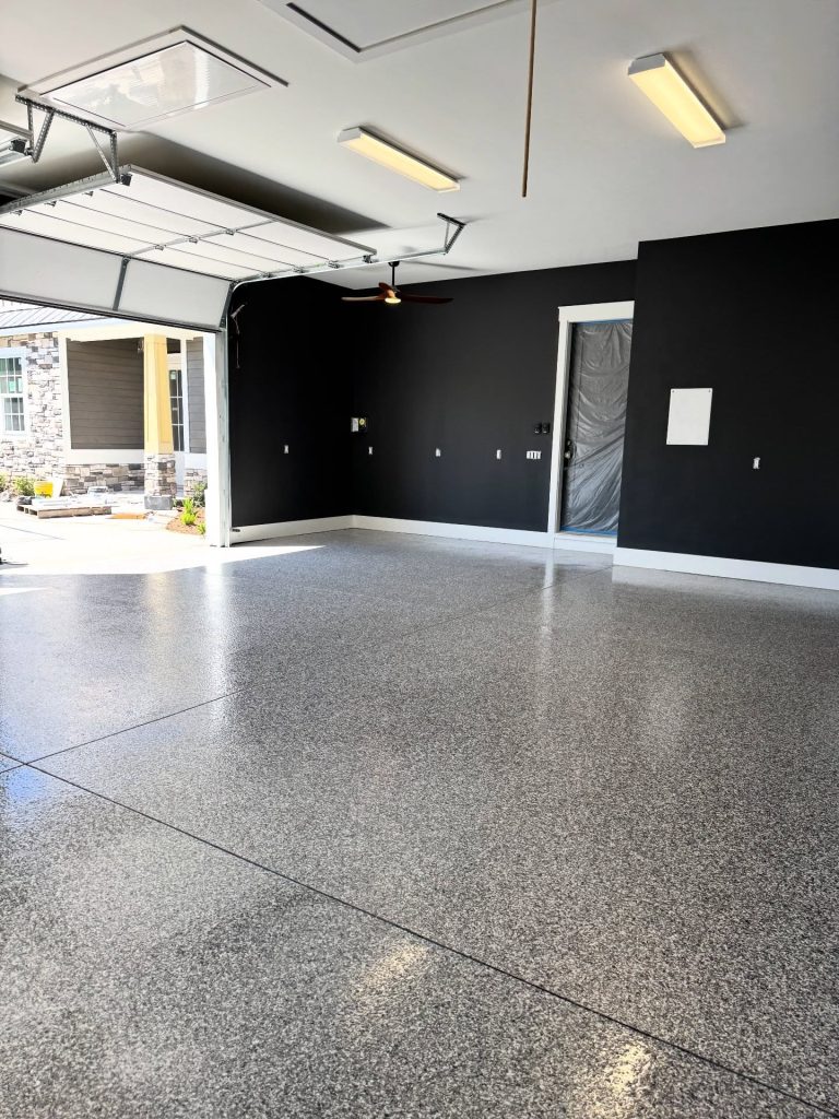 Flake garage floor with black accent walls