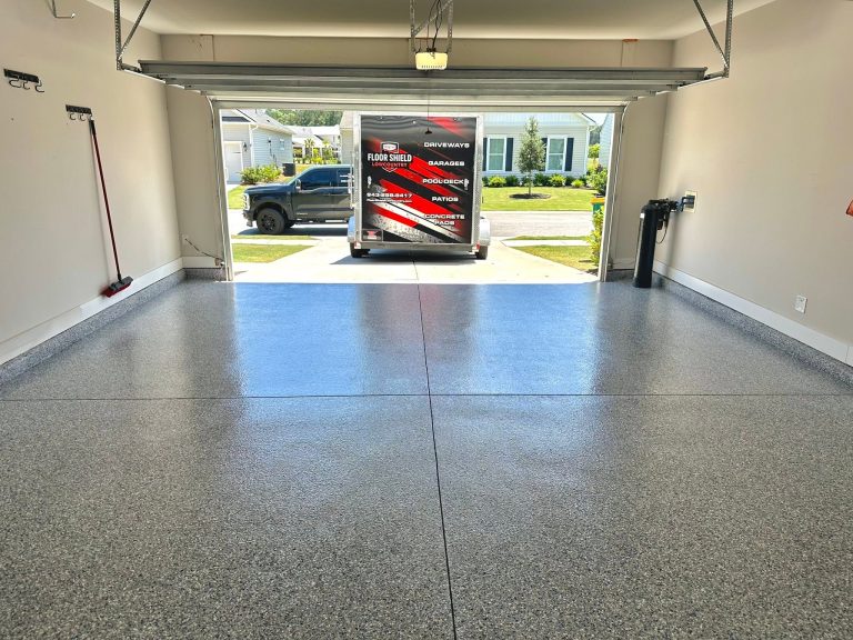 Finished garage floor with the Floor Shield trailer in the driveway