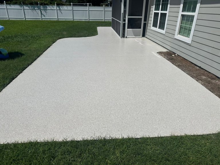 Coated backyard patio along the lawn