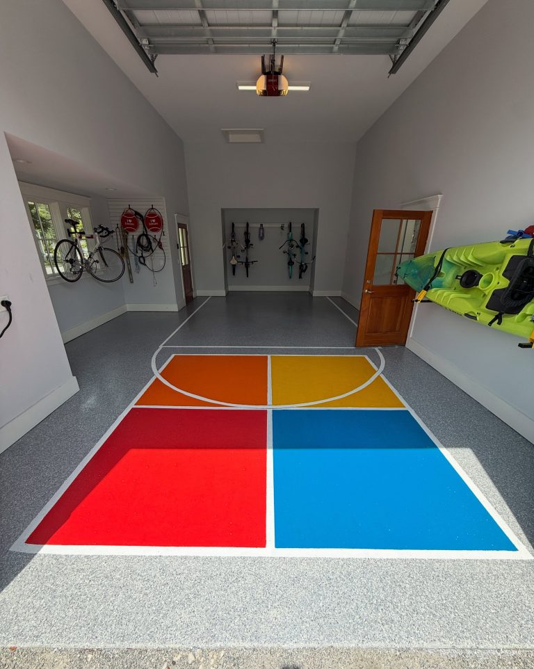 Custom solid color garage floor with a four-color game court