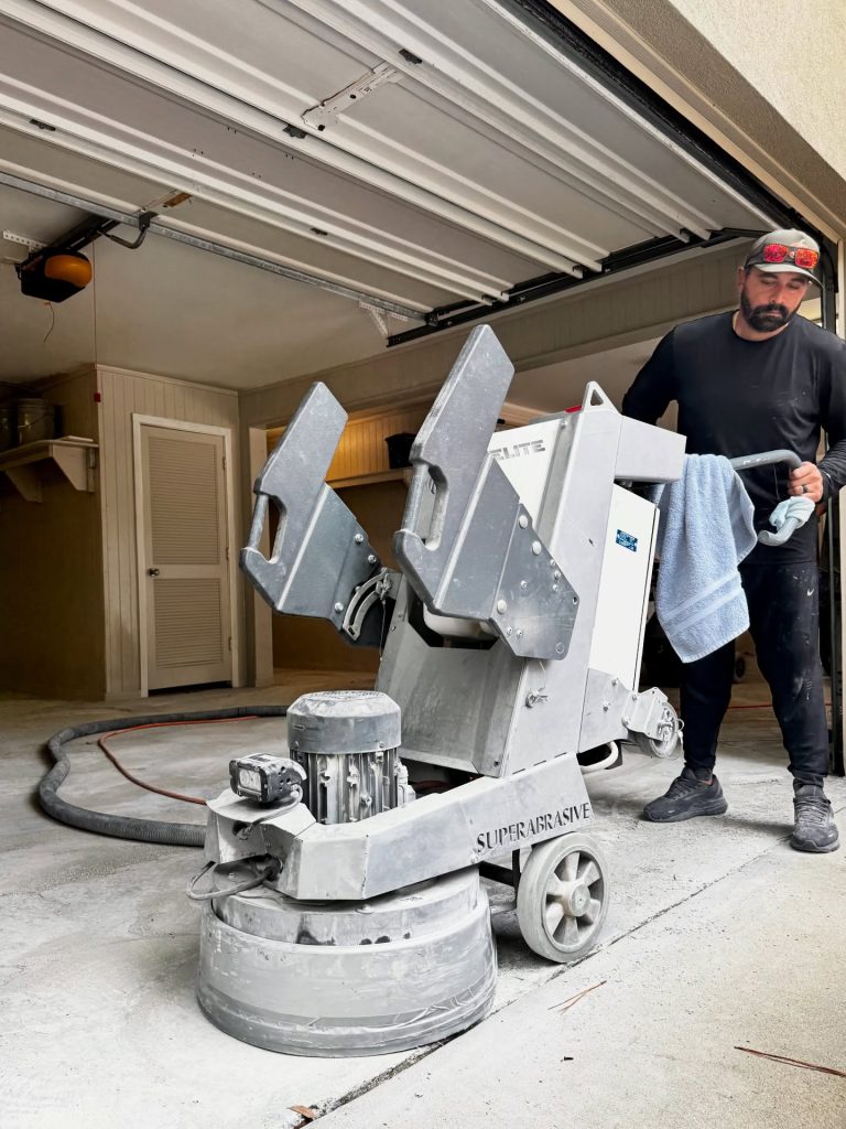 Diamond grinder prepping a garage floor