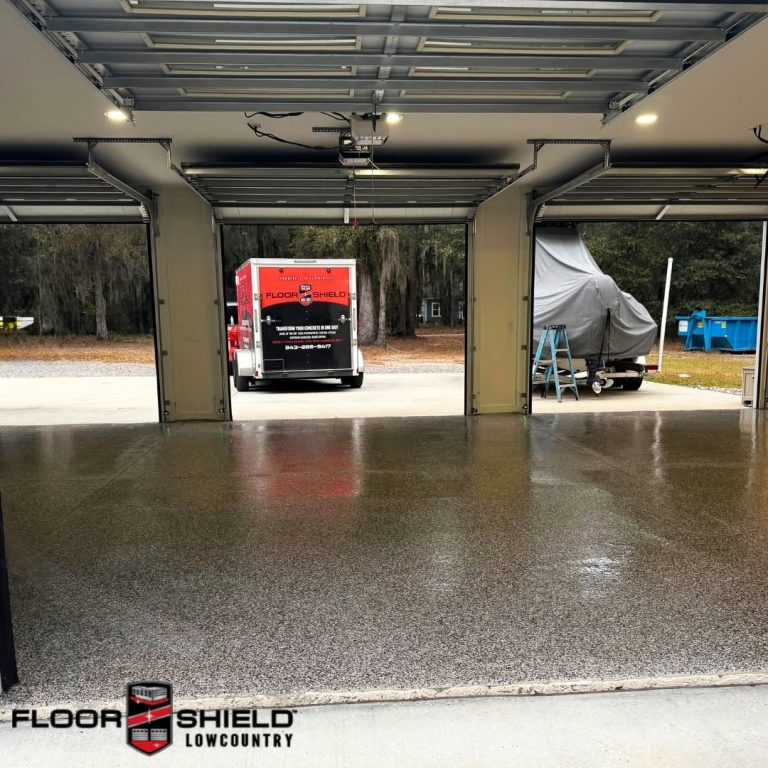 Wide garage with a new flake floor and the Floor Shield trailer
