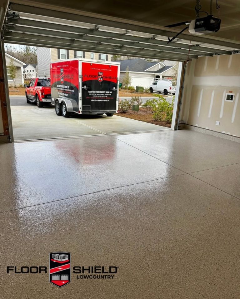 Glossy flake garage floor with the Floor Shield trailer in the driveway