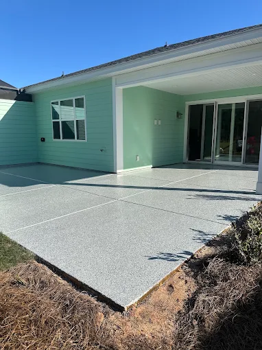 Coated patio beside a blue house